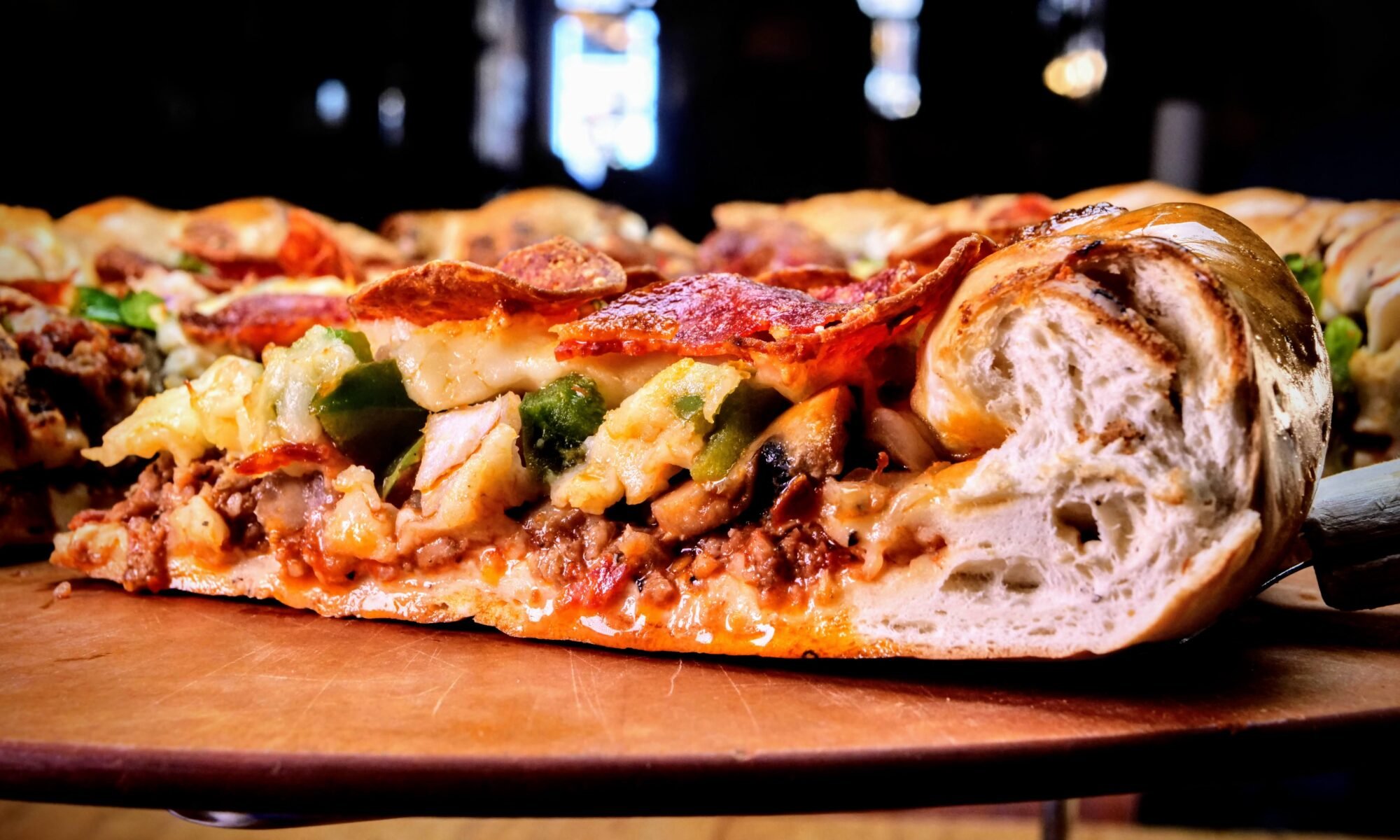 A thick slice of colorado-style pizza from Beau Jo's.
